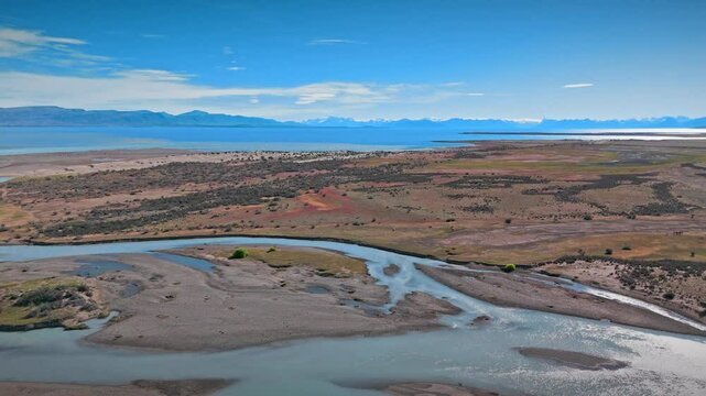 Island Paradise. Argentinian archipelago: Turquoise waters, sandy beaches, dramatic mountains, and a sky full of clouds. A stunning aerial view awaits. 09.01.2025