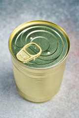 Round Unopened metal can with canned food. Food stocks.