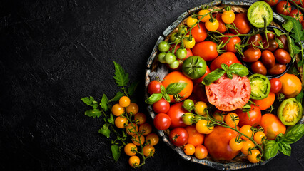 Organic food. Fresh tomatoes in a wooden box. Top view.