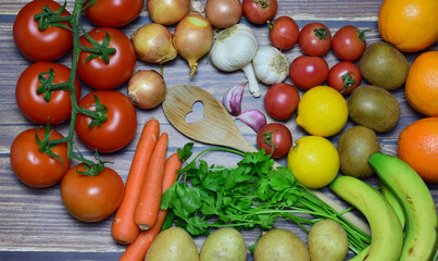 Top view. Rustic background with healthy food, variety of vegetables and fruits.