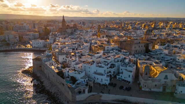 Aerial View of Monopoli, Italy: A captivating aerial view of  bathed in the warm glow of sunset.