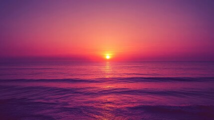 Fototapeta premium Dramatic Purple Sunset over Calm Ocean Waves Reflecting Warm Light.