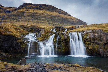 Front view to the Kirkjufell waterfall. Kirkjufellsfoss cascading, Iceland. 