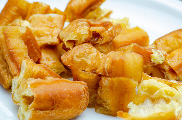 Close up of cut cakoi or youtiao cake on white plate