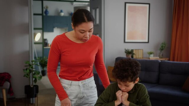 African American family trouble home education afraid little child kid boy son studying learning failure homework bad news woman girl female mother coming room angry talking argument dissatisfied
