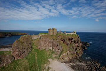 Dunnottar Castle overlooking the North Sea near Stonehaven Scotland on a clear day with scenic coastal views