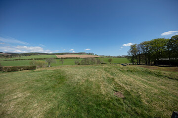Fototapeta premium Scenic view of the peaceful Scottish countryside under a clear blue sky