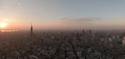 Nighttime view of a river in Bangkok with high-rise office buildings
