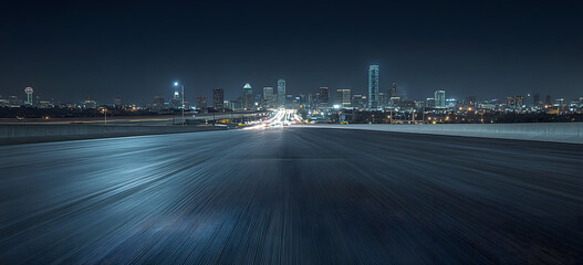 empty highway to the night city skyline