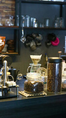 Central Java, Indonesia - 01022025 : A close-up view of a coffee shop counter, showcasing various coffee brewing equipment and accessories.