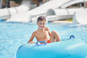 Boy having fun on water slides in Egypt Hurghada