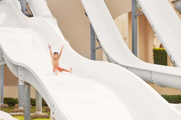 Boy having fun on water slides in Egypt Hurghada