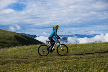 Riding mountain bike on beautiful mountain top