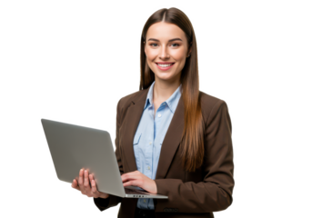 A smiling woman with long straight brown hair, wearing a brown blazer over a light blue shirt, holding a laptop and standing by a large window