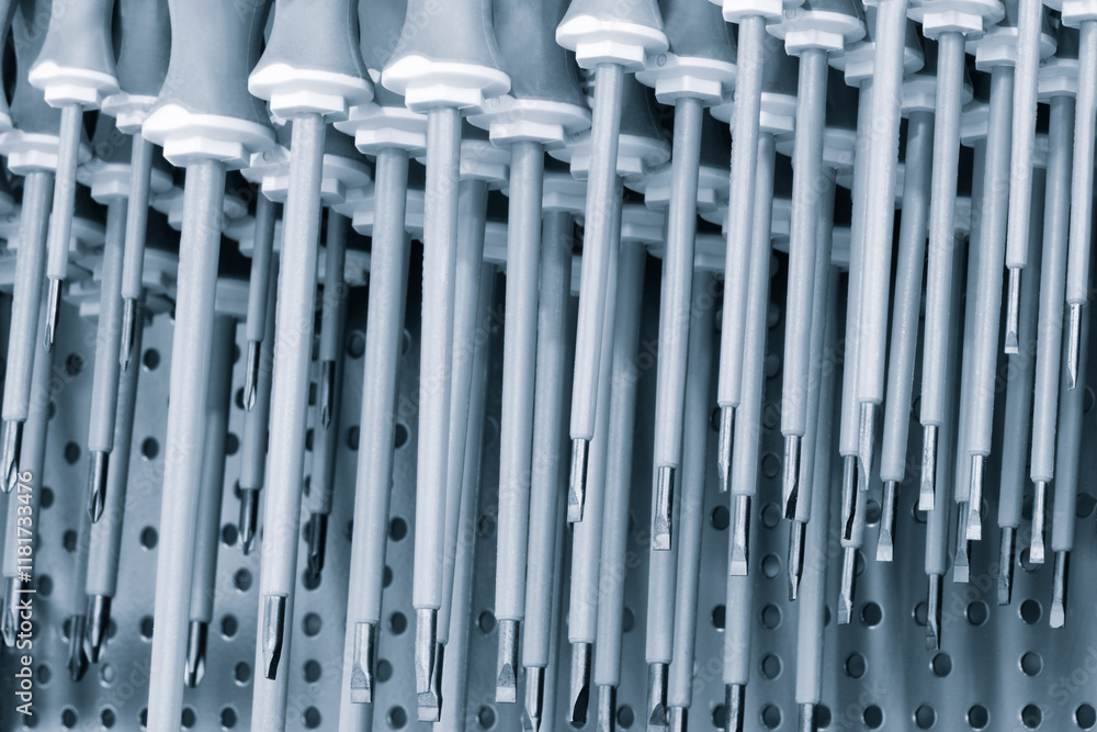 Poster screwdrivers on a showcase in a tool store, tool concept background