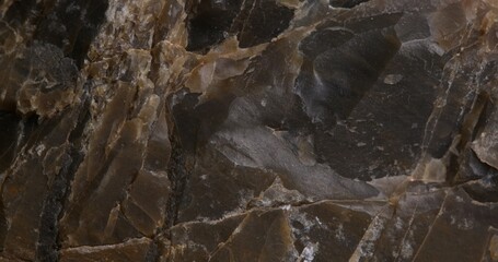 Close-up of a Rough Dark Rock Surface with Textured Layers