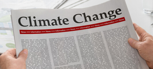 Newspaper with the headline Climate change