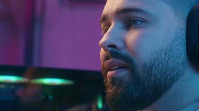 Stressed sleepy tired exhausted upset sad Caucasian man male guy gamer streamer radio host representor working playing online video game computer at night neon sport streaming web stream problem lost