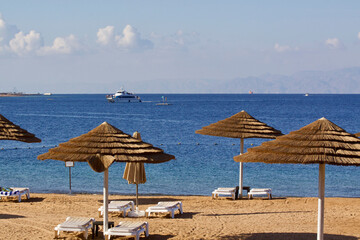 Relax on the beach with umbrellas and sun loungers