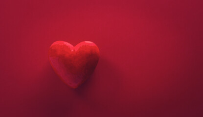 Soft focus of Love and Valentine's day concept made from red hearts on dark red background.