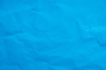 Abstract crumpled blue paper background creased texture