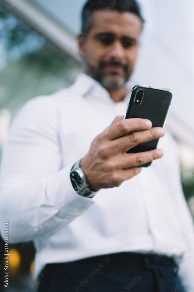 Aufkleber below view of blurred businessman connecting to wireless for browsing banking application on modern 