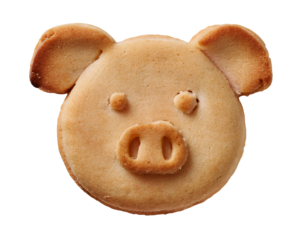 Adorable pig-shaped butter cookie with minimalistic facial details on an isolated black background, perfect for animal-themed desserts and creative snack photography
