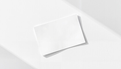Blank white card on minimalistic white background