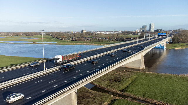 Zwolle, the Netherlands - January 8th 2025: Aerial view of the A28 or E232 highway crossing the river IJssel into Overijssels capital Zwolle.