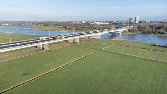 Zwolle, the Netherlands - January 8th 2025: Aerial view of the A28 or E232 highway crossing the river IJssel into Overijssels capital Zwolle.