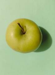 Green Apple isolated on blue background 