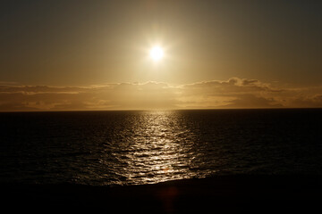 Breathtaking sunset over the waters of Isle of Skye in Scotland showcasing vibrant colors and a tranquil atmosphere