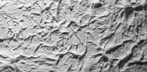 Sliding stone plaster in the image of a lifeless cold desert in the form of abstraction
