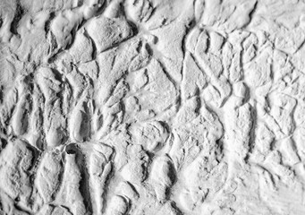 Sliding stone plaster in the image of a lifeless cold desert in the form of abstraction