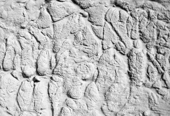 Sliding stone plaster in the image of a lifeless cold desert in the form of abstraction