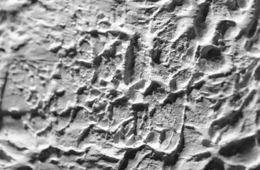 Sliding stone plaster in the image of a lifeless cold desert in the form of abstraction