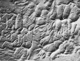 Sliding stone plaster in the image of a lifeless cold desert in the form of abstraction