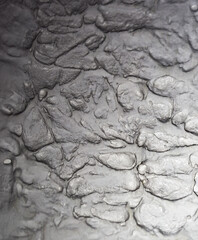 Sliding stone plaster in the image of a lifeless cold desert in the form of abstraction