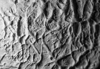 Sliding stone plaster in the image of a lifeless cold desert in the form of abstraction