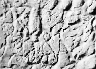 Sliding stone plaster in the image of a lifeless cold desert in the form of abstraction