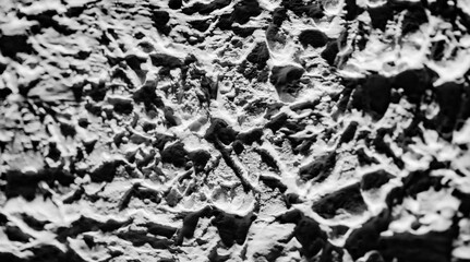 Sliding stone plaster in the image of a lifeless cold desert in the form of abstraction