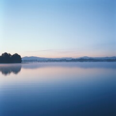 Fototapeta premium Misty dawn reflections serene lake viewpoint in a natural tranquil environment