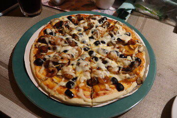 Homemade pizza with shrimp and olives