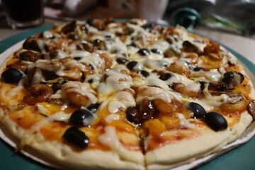 Homemade pizza with shrimp and olives