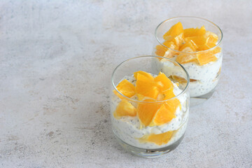 a healthy brunch with chia pudding and orange fruit copy space