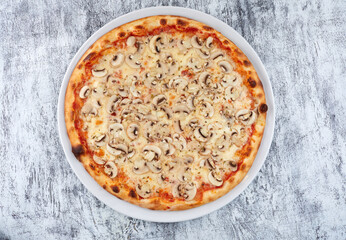 fresh pizza on the white plate