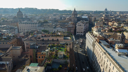 Fototapeta premium Aerial shot capturing the classical architecture of Rome, Italy, showcasing historic buildings with columns, arches, and intricate details