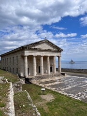 Fototapeta premium historical building on top of the cliff with sea view background