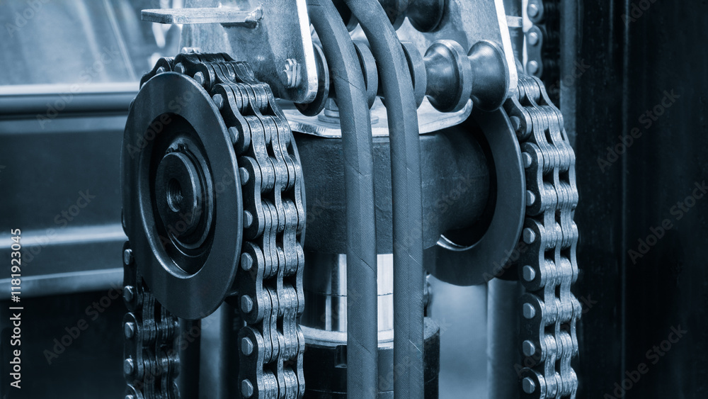 Poster a chain is shown in a blue and black color. the chain is made of metal and is used in a machine