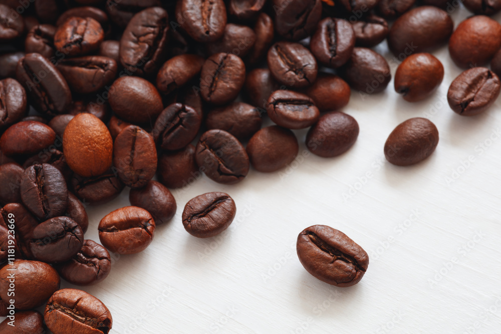 Poster A pile of coffee beans with some of them being smaller than the rest. Concept of abundance and variety, as there are many different sizes of coffee beans in the pile